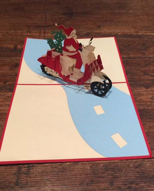 Santa Riding a Scooter (Blue Presents)